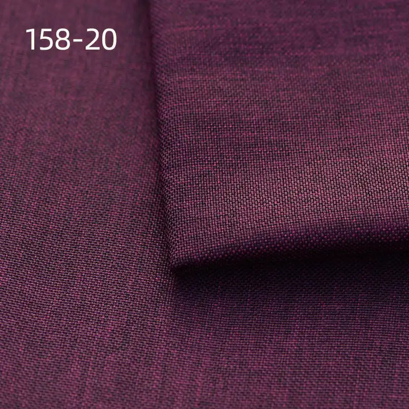 A close-up of dark purple Faux Linen Upholstery Fabric by Longan Craft shows textured polyester material with a folded section on top. The code 158-20 appears in white at the top left. Perfect for upholstering chairs, sofas or curtains.