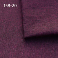 A close-up of dark purple Faux Linen Upholstery Fabric by Longan Craft shows textured polyester material with a folded section on top. The code 158-20 appears in white at the top left. Perfect for upholstering chairs, sofas or curtains.