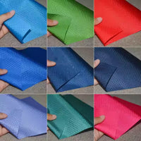 A collage of nine images shows hands holding colorful 210D Honeycomb Pattern Oxford Fabric by Longan Craft, featuring a subtle geometric design. This waterproof, PU coated material is ideal for outdoor gear and sold by the yard.
