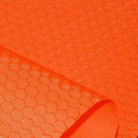 Close-up of Longan Craft’s 210D Honeycomb Pattern Oxford Fabric by the Yard, a colorful PU coated, waterproof polyester ideal for outdoor use, featuring a hexagonal honeycomb design with one edge rolled to showcase texture.