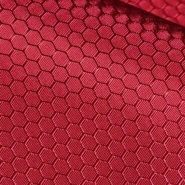 Close-up of Longan Craft's 210D Honeycomb Pattern Oxford Fabric By The Yard, featuring a colorful PU-coated, waterproof finish—perfect for outdoor use with its textured, geometric look and red hue.