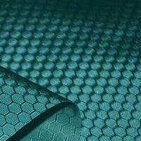 A close-up of Longan Craft’s 210D Honeycomb Pattern Oxford Fabric by the yard shows its colorful hexagonal PU-coated, waterproof polyester surface—flexible and ideal for outdoor use, with one corner lifted to display texture.