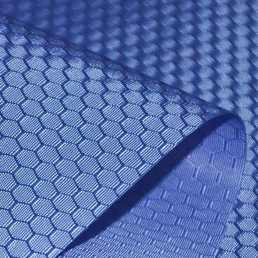 A close-up of Longan Craft’s 210D Honeycomb Pattern Oxford Fabric By The Yard, a colorful PU-coated, waterproof material with a repeating hexagonal design—flexible and ideal for outdoor use.