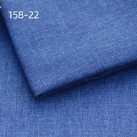 Folded and flat pieces of Longan Craft Faux Linen Upholstery Fabric are displayed in blue with a subtle textured weave. Labeled 158-22 in white text, this polyester fabric is ideal for upholstering chairs, sofas, or curtains.