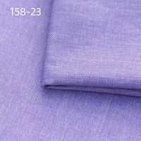 A close-up of folded light purple Faux Linen Upholstery Fabric by Longan Craft, made of polyester with a subtle texture. The number 158-23 appears in the upper left corner.