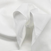 A close-up of Longan Craft Multi Color Microsuede Polyester Peachskin Fabric By The Yard shows its brushed peach skin texture and cozy, soft folds—perfect for clothing.