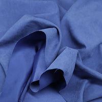 Close-up of Longan Craft Multi Color Microsuede Polyester Peachskin Fabric, showing its soft, brushed texture and subtle folds that create gentle shadows—perfect cozy peachskin material for clothing by the yard.