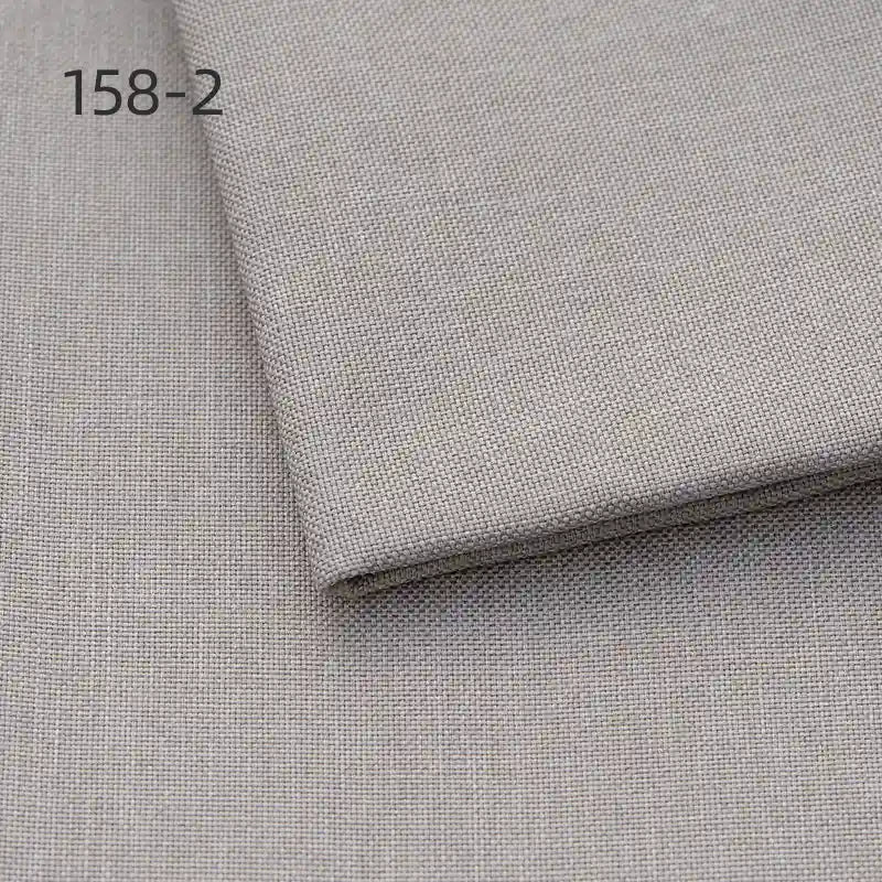 Two pieces of Longan Craft Faux Linen Upholstery Polyester Fabric are stacked, with the top piece slightly folded and code 158-2 in the upper left corner. Ideal for reupholstering chairs, sofas, or curtains. Color: light gray.