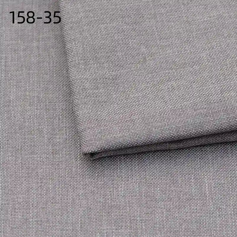 A close-up of two pieces of Longan Craft Faux Linen Upholstery Fabric in light gray polyester, featuring a subtle woven texture and one piece folded over the other. The code 158-35 is shown in black in the top left corner.