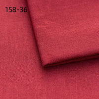 Close-up of deep red Faux Linen Upholstery Fabric by the yard from Longan Craft, made of polyester for reupholstering chairs, sofas, or curtains. Fine woven texture visible; "158-36" is printed in black at the top left corner.