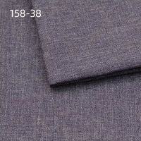 Close-up of Longan Craft Faux Linen Upholstery Fabric in dark gray, featuring a subtle textured weave. The code 158-38 is shown in white in the top left corner. Polyester fabric, ideal for upholstering furniture and reupholstering chairs, sofas, or curtains.