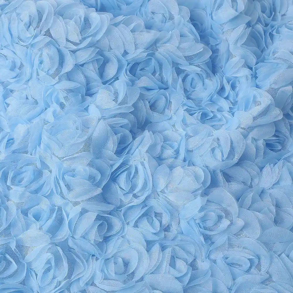 A close-up of Longan Craft’s 3D Blossom Roses Embroidered Tulle Fabric, featuring multicolor floral embroidery with three-dimensional rose ruffles—perfect for creating beautifully textured evening or prom looks.