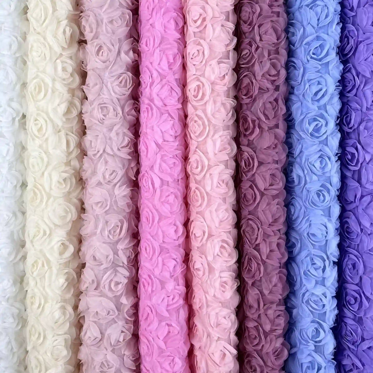Longan Craft’s 3D Blossom Roses Embroidered Tulle Fabric By The Yard features multicolor floral embroidery in pastel shades, making it perfect for wedding or prom dresses with its delicate 3D rose texture.