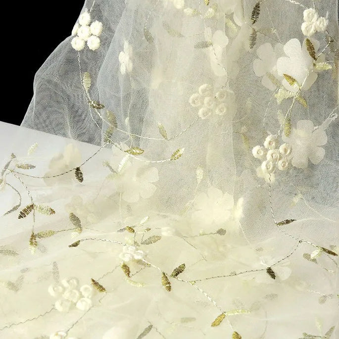 Longan Craft's 3D Floral Embroidered Tulle Fabric by the Yard features colorful botanical embroidery—ideal bridal tulle material for wedding dresses, with delicate flowers and leaves for a romantic look.