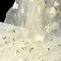 Longan Craft's 3D Floral Embroidered Tulle Fabric by the Yard features colorful botanical embroidery—ideal bridal tulle material for wedding dresses, with delicate flowers and leaves for a romantic look.