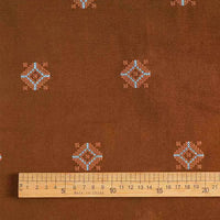 Longan Craft's 3D Patterned Embroidery Corduroy Fabric by the yard is a comfy fine wale cotton corduroy material for clothing, featuring blue and white diamond motifs on brown. Ruler (cm) shown; made in China.