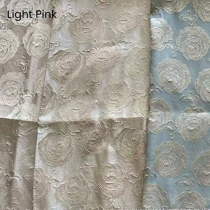Three sections of Longan Craft's 3D Rose Butterfly Brocade Fabric—jacquard with embossed roses—in pinkish beige, cream, and pale blue with pink roses. "Light Pink" appears in the corner. Ideal for dresses or brocade projects.