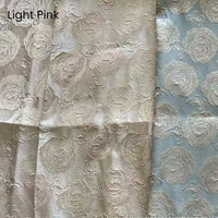 Three sections of Longan Craft's 3D Rose Butterfly Brocade Fabric—jacquard with embossed roses—in pinkish beige, cream, and pale blue with pink roses. "Light Pink" appears in the corner. Ideal for dresses or brocade projects.