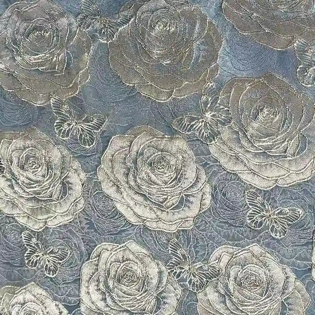 The 3D Rose Butterfly Brocade Fabric by Longan Craft features silvery jacquard roses and butterflies on a light blue background, creating an elegant, textured look—ideal for dresses and perfect for adding sophistication to your projects.