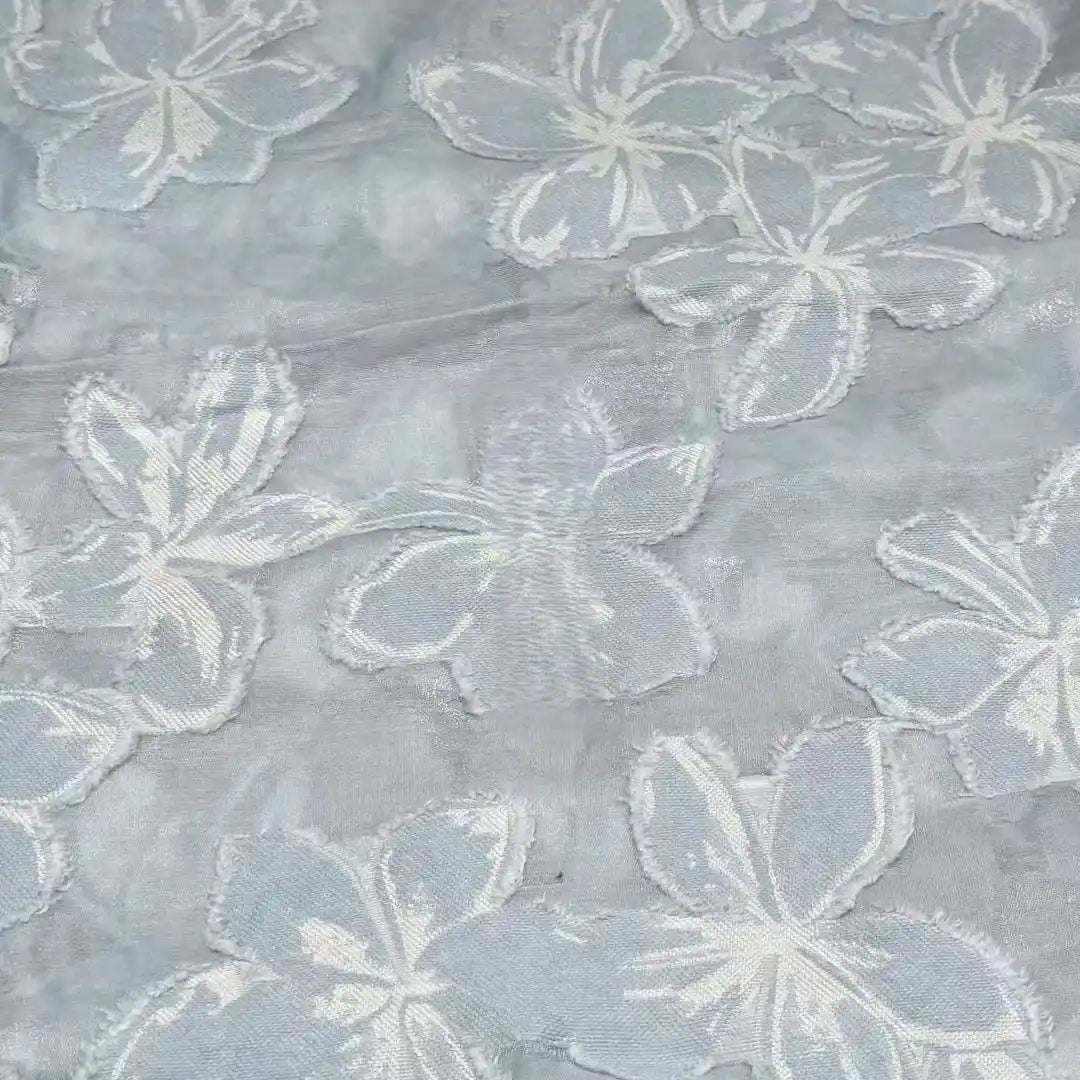Close-up of Longan Craft’s 3D Floral Patchwork Rayon Fabric by the yard, featuring a soft green rayon base with large overlapping flower patterns—ideal for delicate, textured dresses.