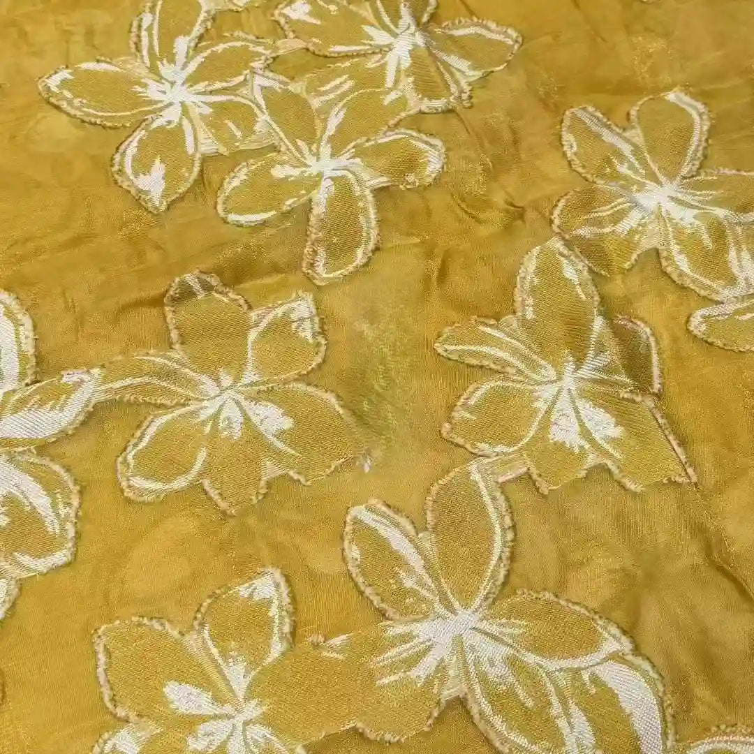 The 3D Floral Patchwork Rayon Fabric by Longan Craft is a green, soft rayon material with a flower pattern, ideal for dresses and available by the yard.