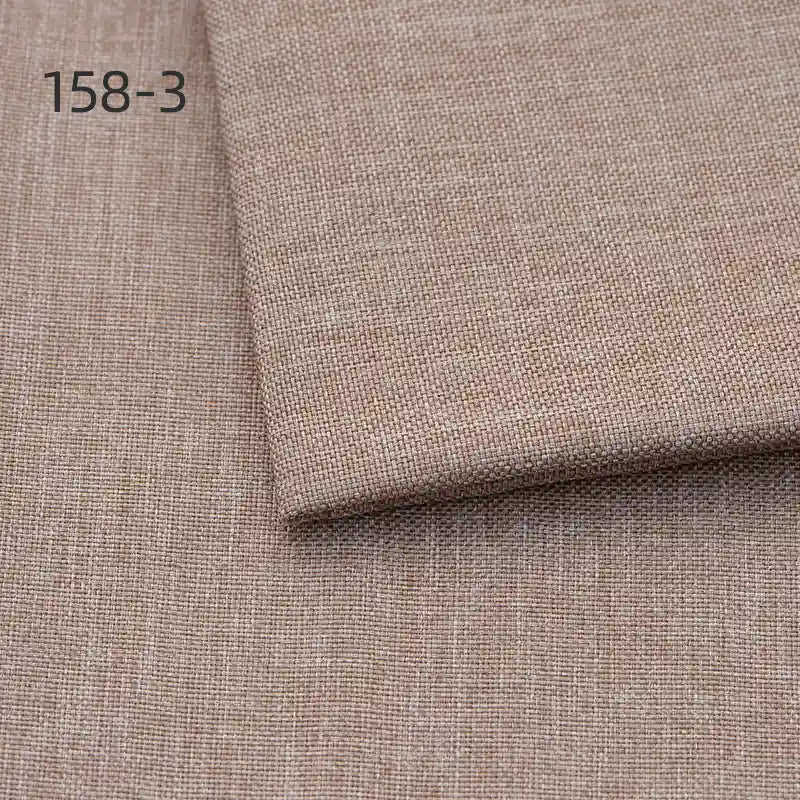 A close-up of Longan Craft's Faux Linen Upholstery Fabric by the yard shows light brown polyester with a subtle texture, plus a folded piece on top. The number 158-3 appears in the upper left corner.