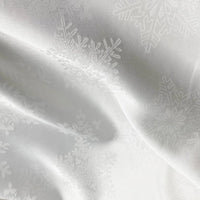 Longan Craft’s Snowflake Jacquard Satin Fabric by the yard features a subtle snowflake pattern on smooth white polyester satin—perfect for elegant dresses and crafts.