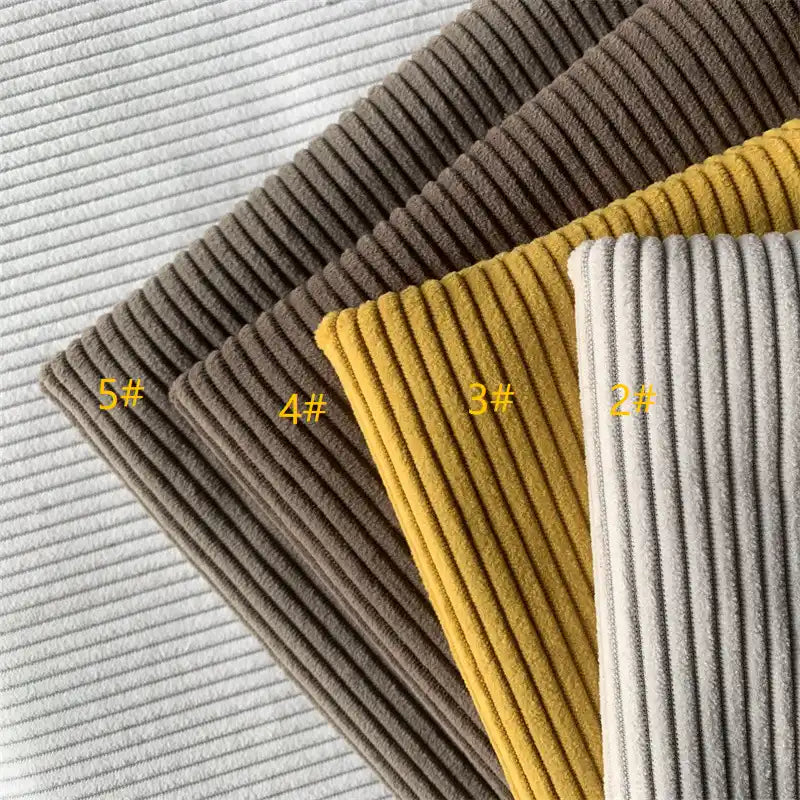 Four swatches of Longan Craft 4.5 Wale Polyester Corduroy Fabric are stacked diagonally in light gray, brown, mustard yellow, and beige. Each solid color upholstery fabric is labeled 5#, 4#, 3#, and 2# from left to right.