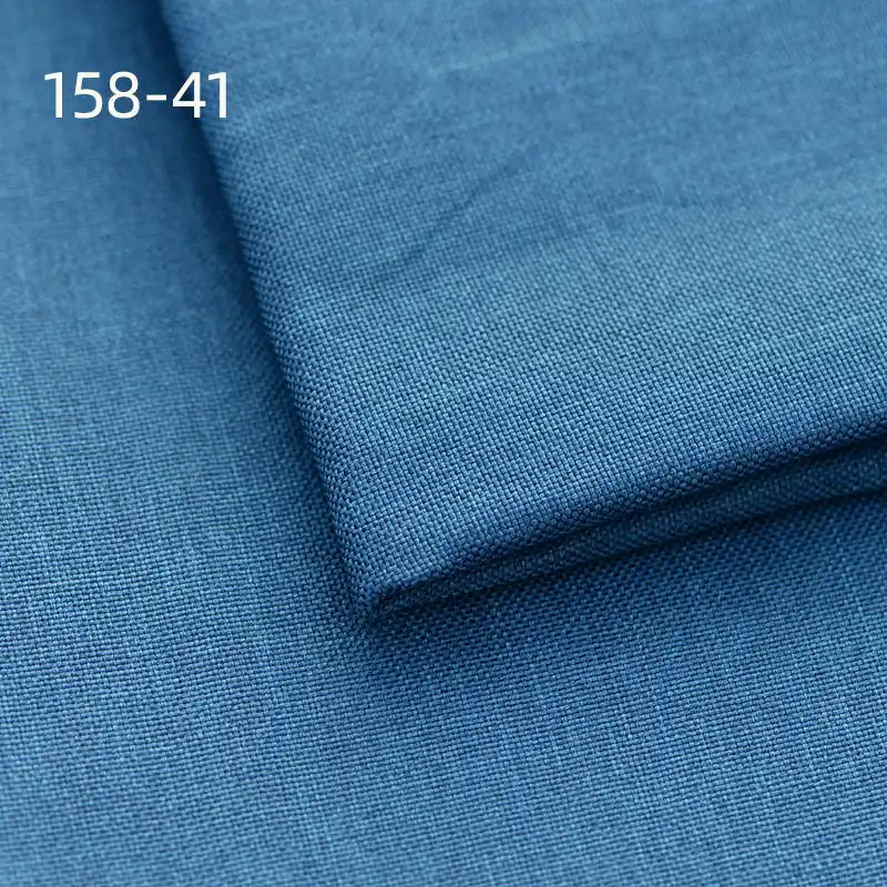 Close-up of two stacked pieces of Longan Craft Faux Linen Upholstery Fabric (Polyester, 158-41), highlighting the blue texture. Ideal for chairs, sofas, and curtains.