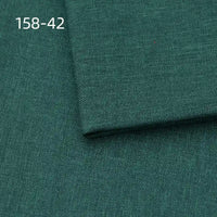 Longan Craft Faux Linen Upholstery Fabric in dark green polyester is shown with a folded corner revealing weave detail. The listing number 158-42 appears in white text at the upper left. Ideal for reupholstering chairs, sofas, or curtains by the yard.