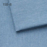 A close-up of two pieces of Longan Craft Faux Linen Upholstery Fabric By The Yard, light blue polyester fabric for reupholstering furniture, with "158-8" in black text in the top left corner.