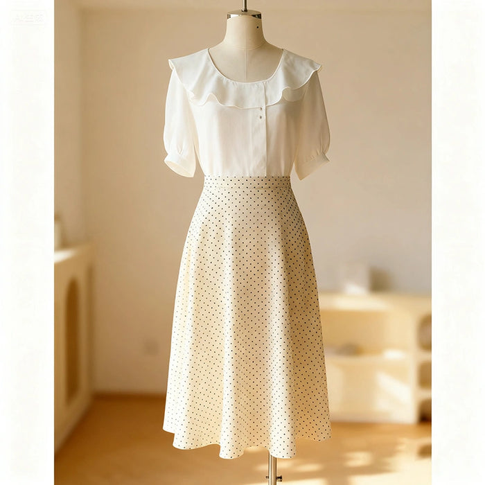 A cream-colored, mid-length A-line skirt with a subtle polka dot pattern, made using the Longan Craft Women A-line Midi Skirt Sewing Pattern (Free PDF). Displayed on a mannequin in a softly lit room.