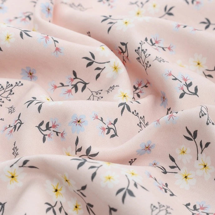 Longan Craft’s Animal and Botanical Printed Jersey Fabric By The Yard is a heavy weight cotton sweatshirt jersey with a soft, smooth texture and features delicate floral patterns in yellow, blue, red, and dark green.