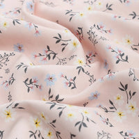 Longan Craft’s Animal and Botanical Printed Jersey Fabric By The Yard is a heavy weight cotton sweatshirt jersey with a soft, smooth texture and features delicate floral patterns in yellow, blue, red, and dark green.