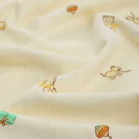 Longan Craft’s Animal and Botanical Printed Jersey Fabric is a cream-colored, heavy-weight 100% cotton sweatshirt jersey by the yard, with playful prints of toys, animals, and gifts across its soft surface.