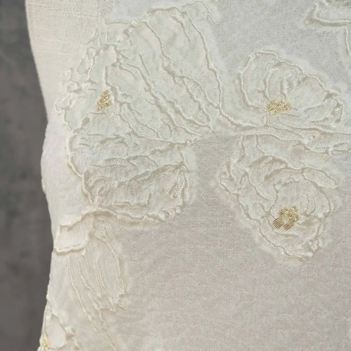Close-up of Longan Craft’s Apricot Rose Embossed Organza Fabric by the yard, featuring soft, off-white 3D floral jacquard with textured embroidery and subtle gold accents—ideal for summer dresses.