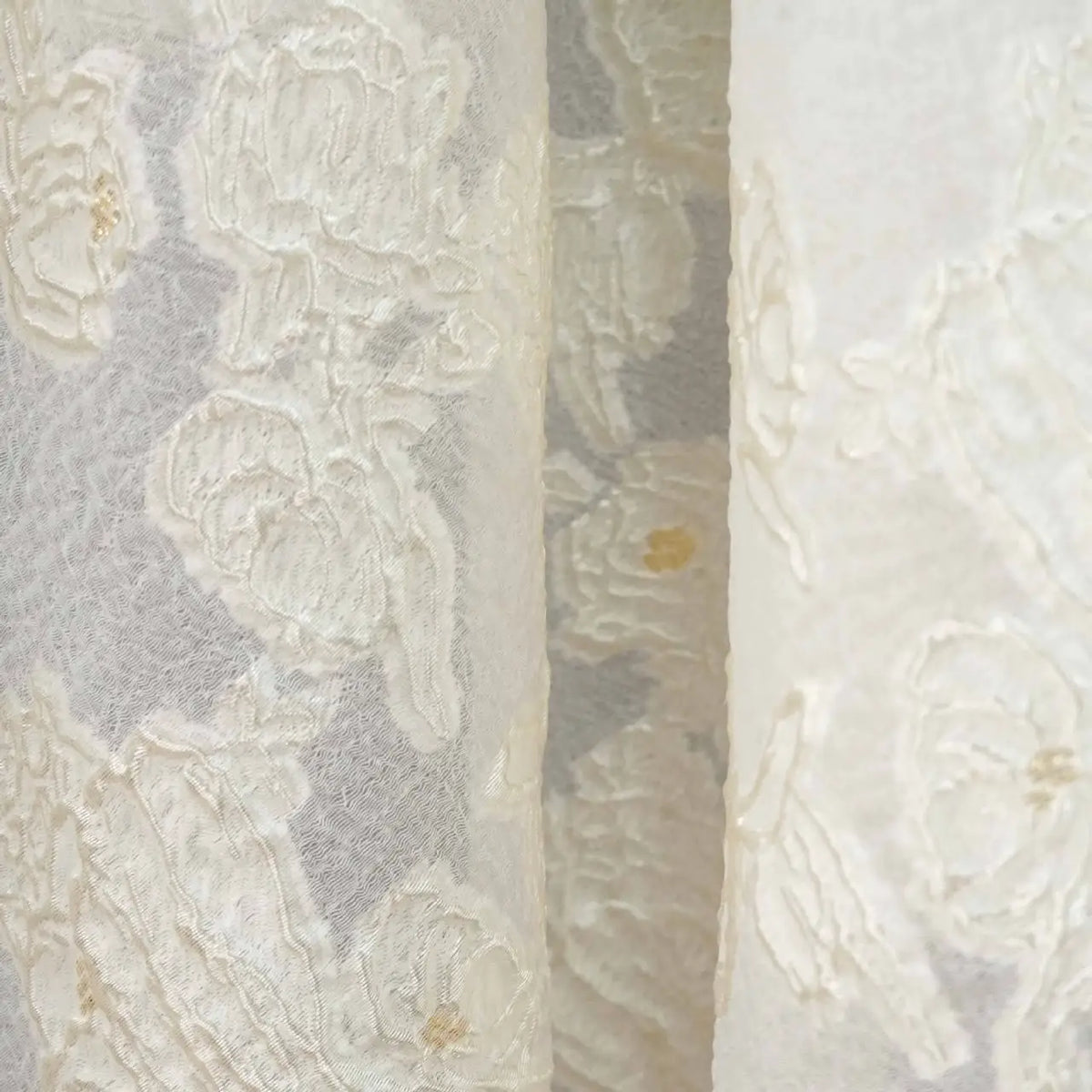 Close-up of Longan Craft's Apricot Rose Embossed Organza Fabric by the yard, featuring a soft 3D floral jacquard pattern. The elegant organza material highlights intricate designs, perfect for summer dresses.