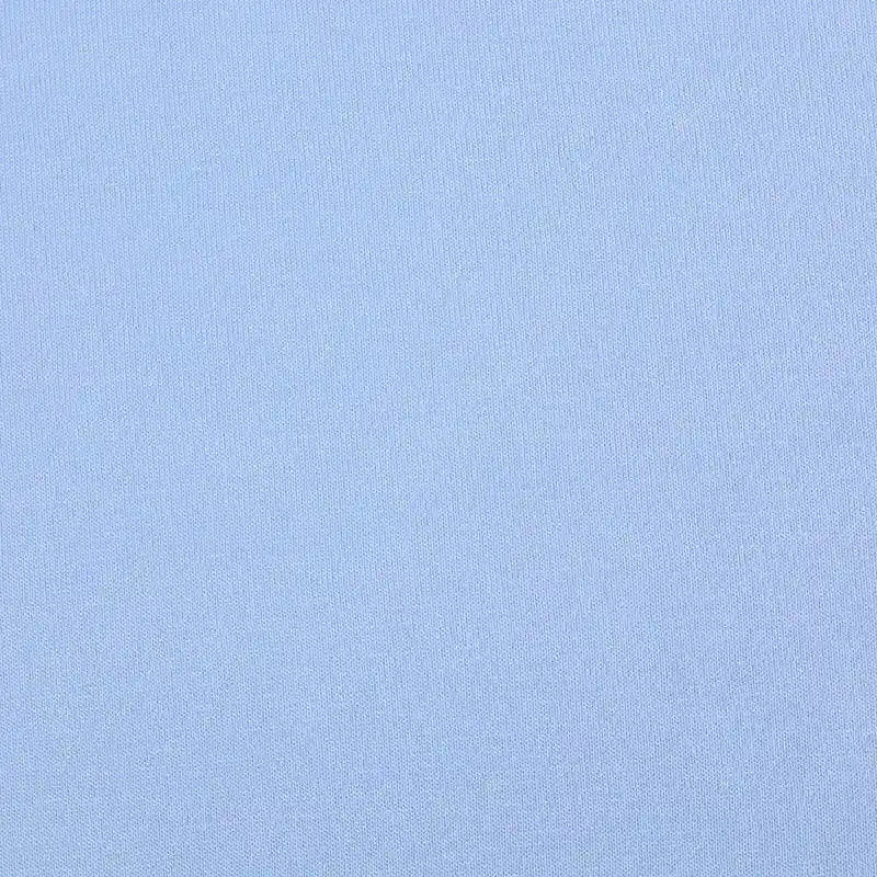 A close-up of Longan Craft’s Bamboo Jersey Fabric By The Yard, a soft, plain light blue single elastane jersey textile ideal for loungewear, showing its smooth texture with no visible patterns or distinct features.