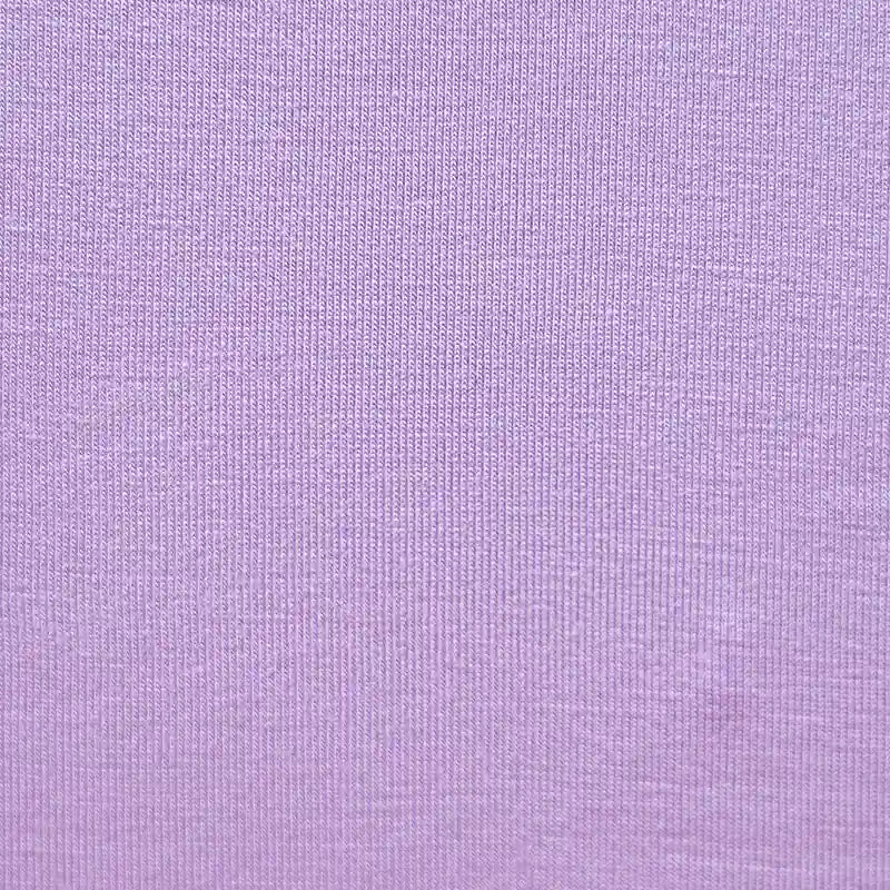 Close-up of Longan Craft's Bamboo Jersey Fabric By The Yard—a soft, plain color single elastane jersey with fine knit texture, ideal for eco-friendly loungewear and baby clothing.