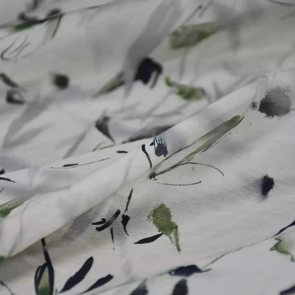 Close-up of Longan Craft's Bamboo Printed Nylon Viscose Fabric By The Yard, featuring a Chinoiserie watercolor floral in black, green, and gray on lightweight, slightly translucent premium viscose—ideal for dressmaking.