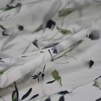 Close-up of Longan Craft's Bamboo Printed Nylon Viscose Fabric By The Yard, featuring a Chinoiserie watercolor floral in black, green, and gray on lightweight, slightly translucent premium viscose—ideal for dressmaking.