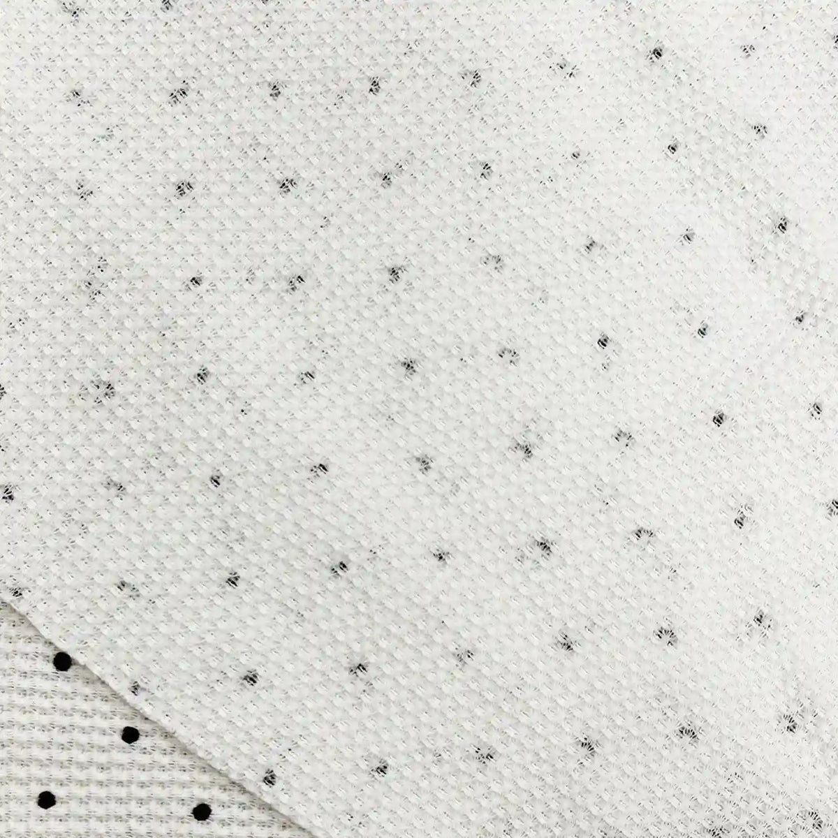 Black Mini Polka Dot Print Waffle Fabric By The Yard, featuring a white waffle knit T-shirt fabric with a small, scattered black mini polka dot pattern.