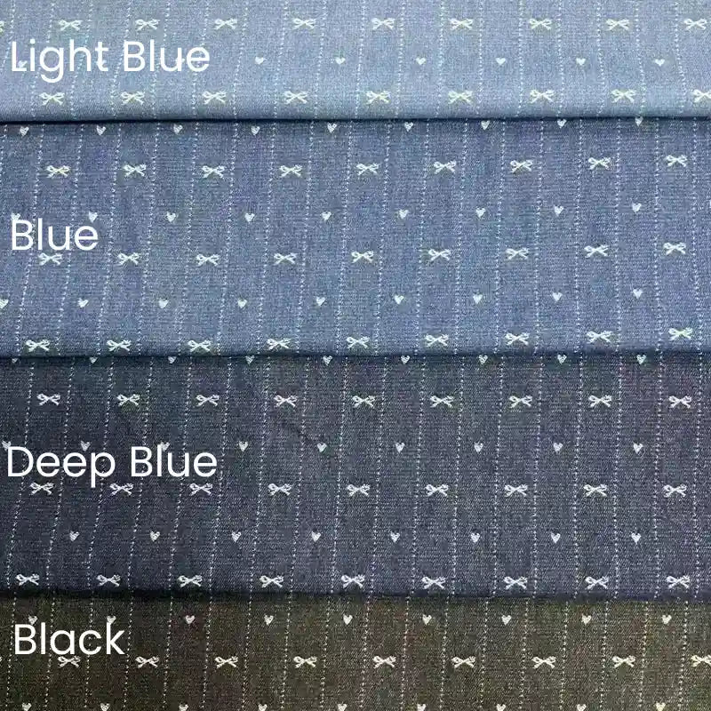 Four stacked Bow Heart Jacquard Denim fabrics by Longan Craft in Light Blue, Blue, Deep Blue, and Black. Each soft cotton-polyester blend features subtle white bows and dots on a textured striped surface—ideal for pants.