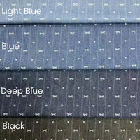Four stacked Bow Heart Jacquard Denim fabrics by Longan Craft in Light Blue, Blue, Deep Blue, and Black. Each soft cotton-polyester blend features subtle white bows and dots on a textured striped surface—ideal for pants.