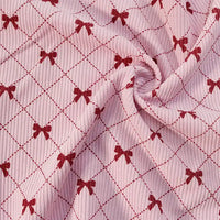 Longan craft’s Bow Plaid Print Corduroy Fabric By The Yard is a heavyweight, soft, and durable corduroy material featuring a red bow and diamond grid check print. The fabric’s gathered center creates gentle folds and rich texture, making it ideal for clothing projects.