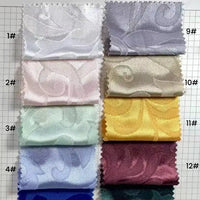 Twelve numbered Brocade Damask fabric swatches by Longan Craft, ideal for evening gowns or upholstery, display vintage floral patterns in vibrant and pastel shades—white, pink, blue, maroon—arranged neatly in two columns.