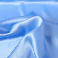 Longan Craft Charmeuse Silk Fabric by the yard in light blue—solid color mulberry silk satin with a luxurious, shiny finish and soft drape—ideal for bridal or special occasion garments.