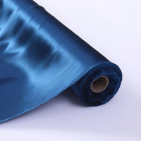 A partially unrolled roll of Longan Craft Charmeuse Silk Fabric By The Yard highlights its glossy, smooth mulberry silk satin texture and rich blue color—perfect as a luxurious bridal fabric.