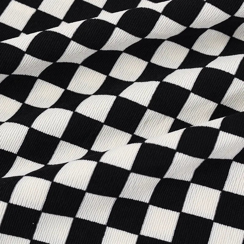 A close-up of Longan Craft’s Checkered Corduroy Fabric By The Yard shows evenly spaced black and white checks on soft, printed polyester corduroy, with vintage-style ribbed texture ideal for apparel projects.