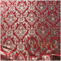 Longan Craft's Chenille Damask Fabric by the yard features a red background with gold and silver symmetrical floral jacquard motifs. This elegant damask upholstery fabric may show slight wrinkles in the lower area.